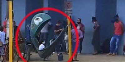 Imagens de pessoas deitadas em rede na fila de banco viraliza na internet