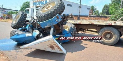 Trator cai de prancha de caminhão na 25 de Agosto em Rolim de Moura