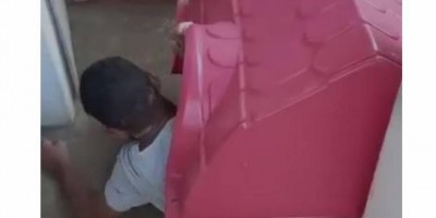 Homem embriagado é flagrado pela polícia dormindo em casa de cachorro em Vilhena