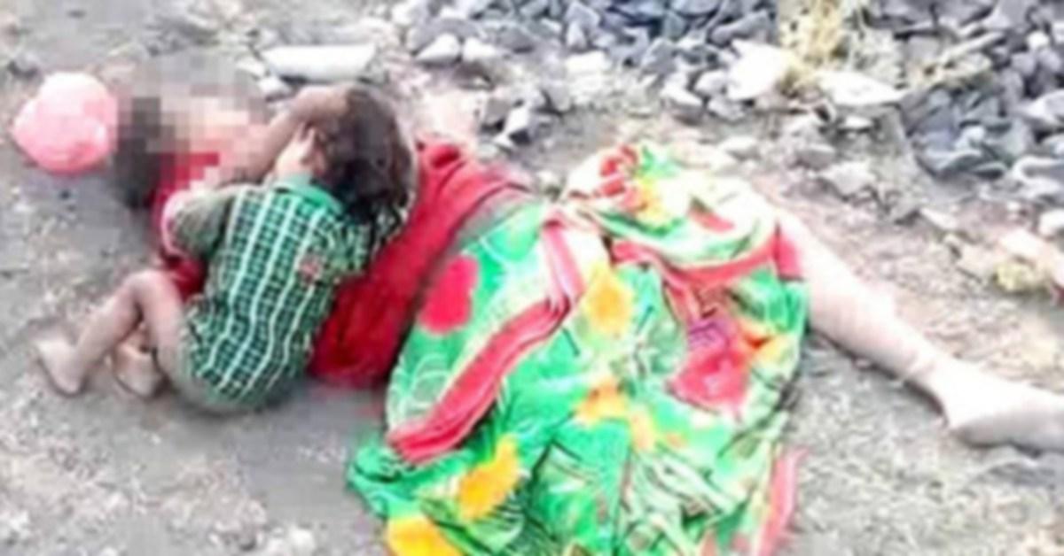 Criança mama no corpo da mãe caída ao chão sem vida e emociona a Web; Veja a imagem triste Criança mama no corpo da mãe caída ao chão sem vida e emociona a Web; Veja a imagem triste